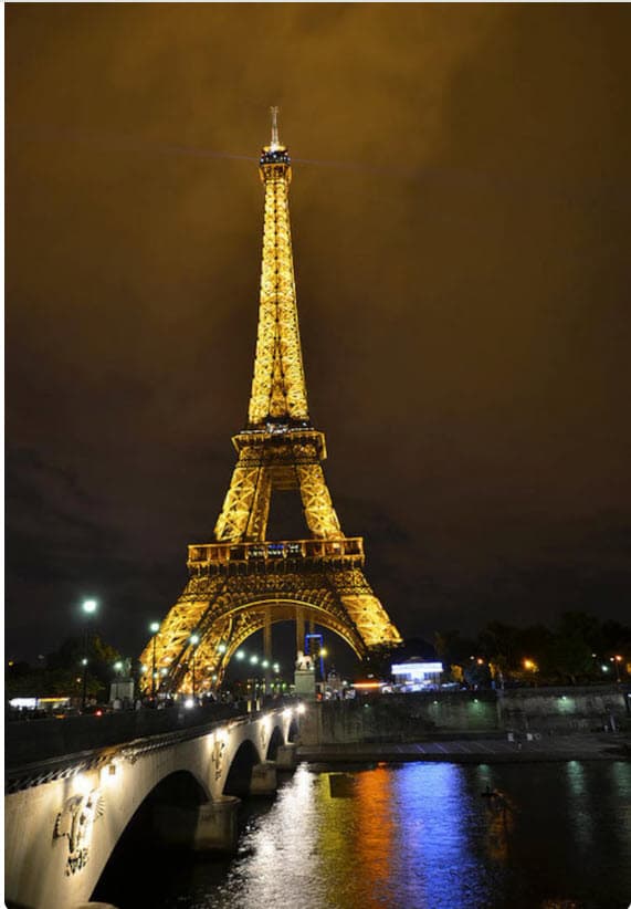 The Eiffel Tower lit at night.