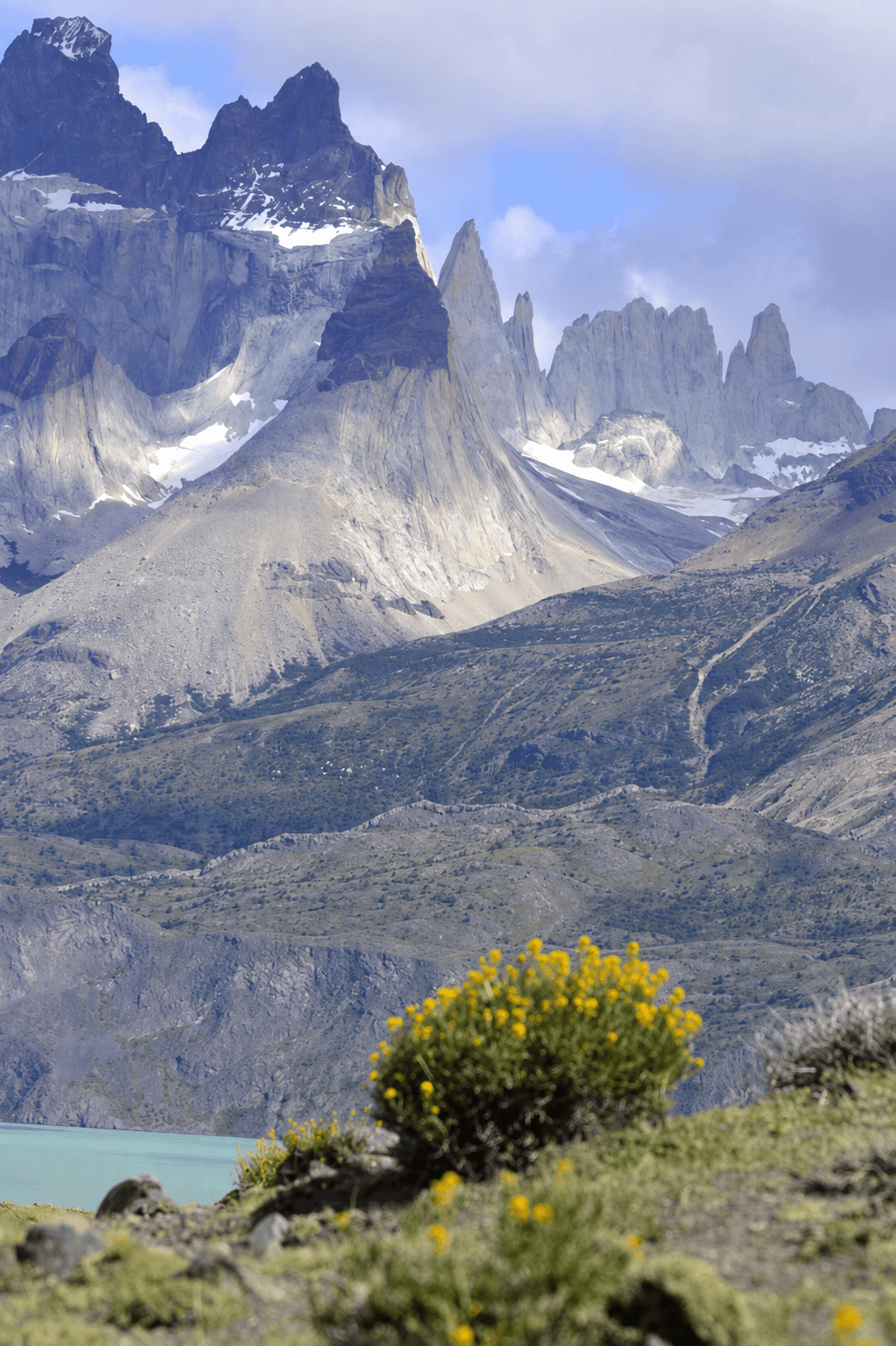 The jagged mountain peaks of Torres del Paine rising above the Patagonian landscape.